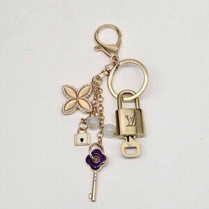 Authentic Louis Vuitton Lock & Key with unbranded Clover Flower Bagcharm 111225